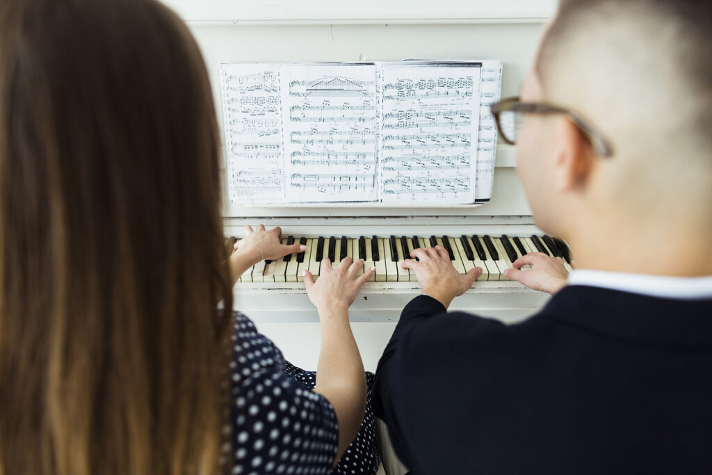 A focused face-to-face piano lesson